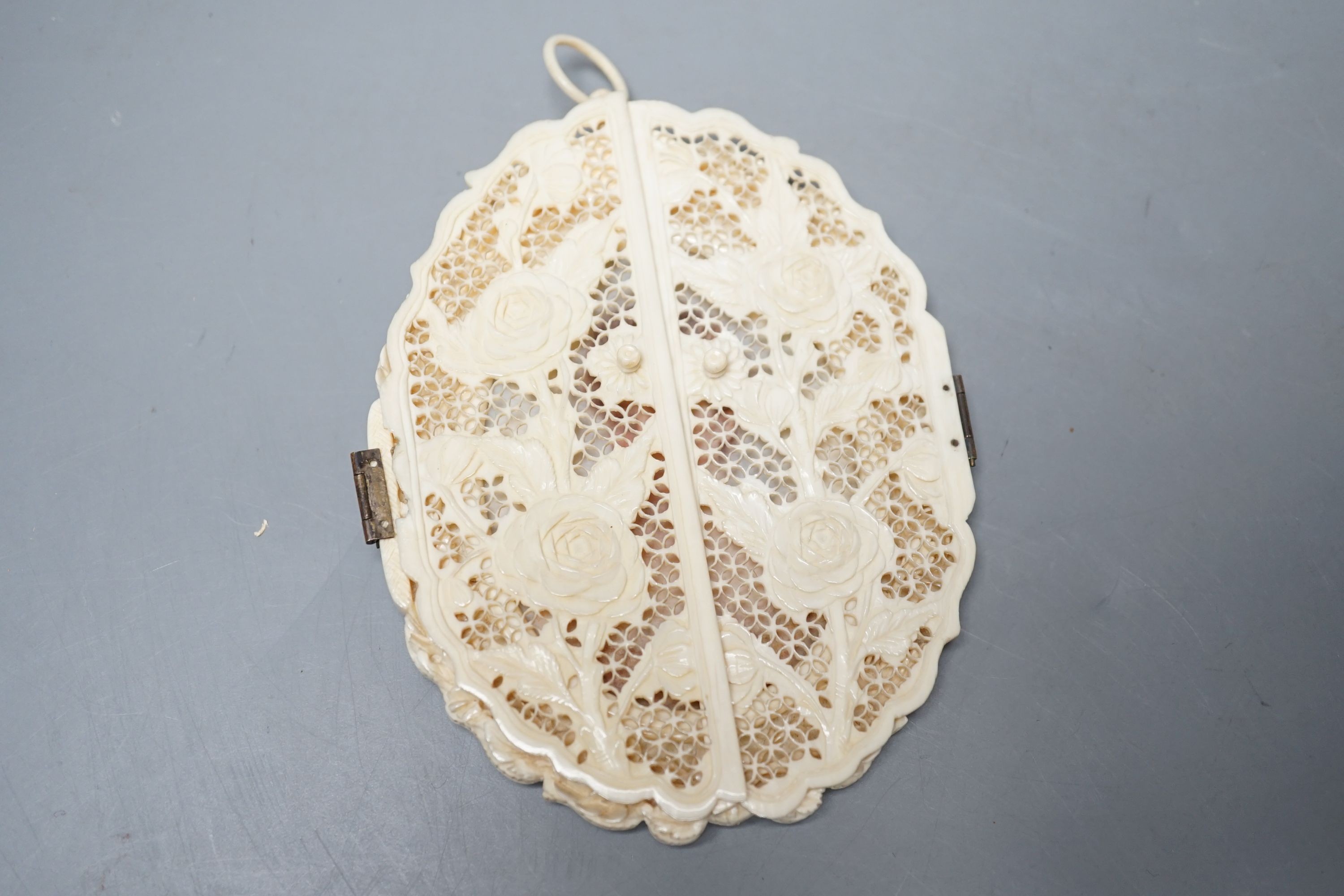 A carved and pierced ivory framed miniature. ‘Edith wife of C.Constable Curtis Esq. Collingshaw Newark - Painted by K.Wilfred Collyer 8th October 1892’ to reverse, 11.5cm high
